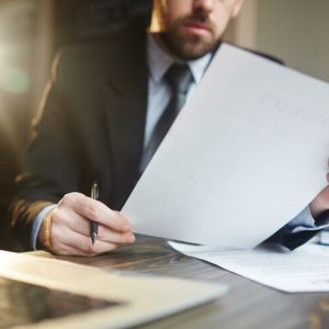 businessman-working-with-documentation-desk_1098-15981